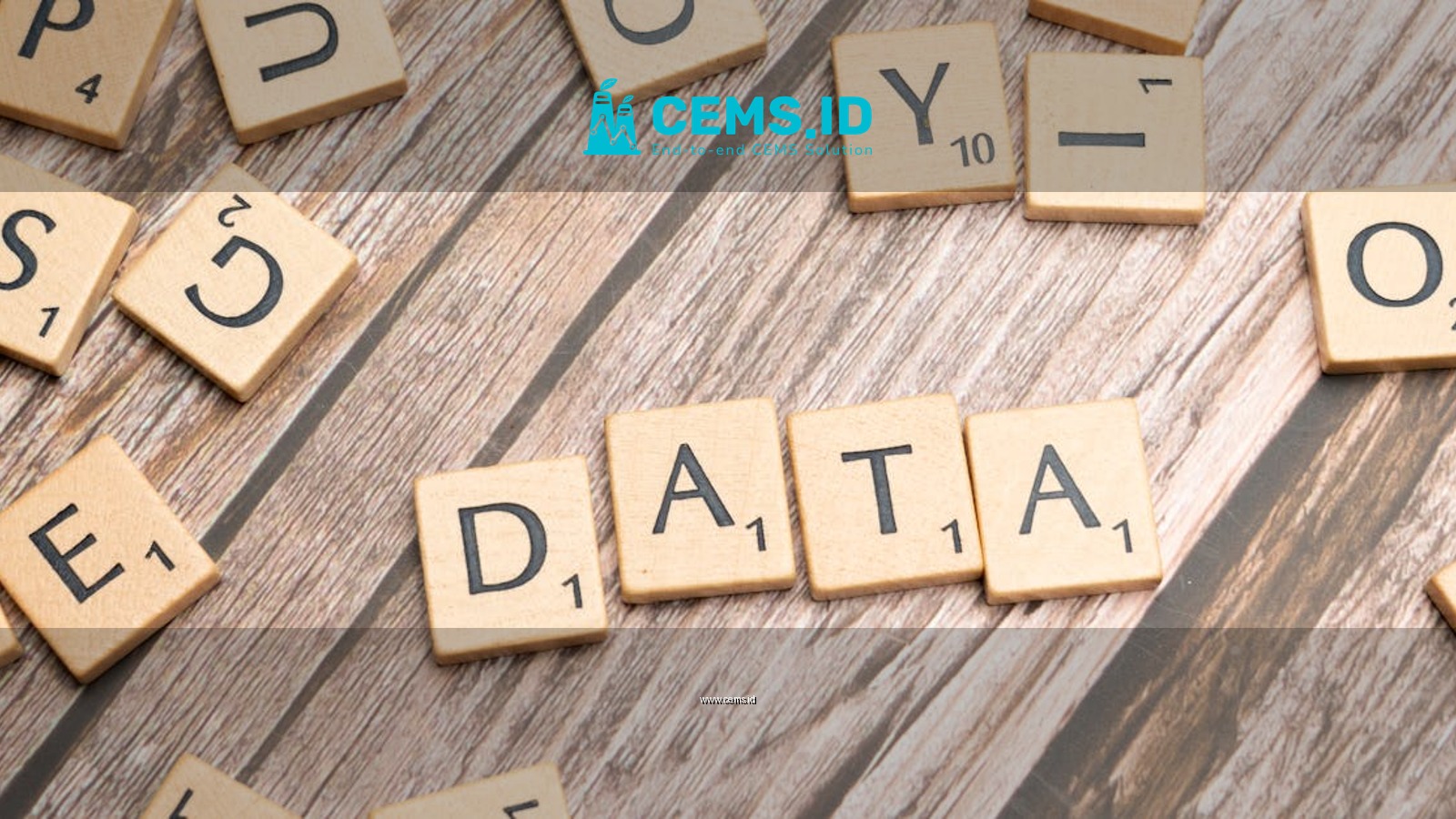 Wooden letter tiles spelling 'DATA' on a wood textured surface, symbolizing data concepts.