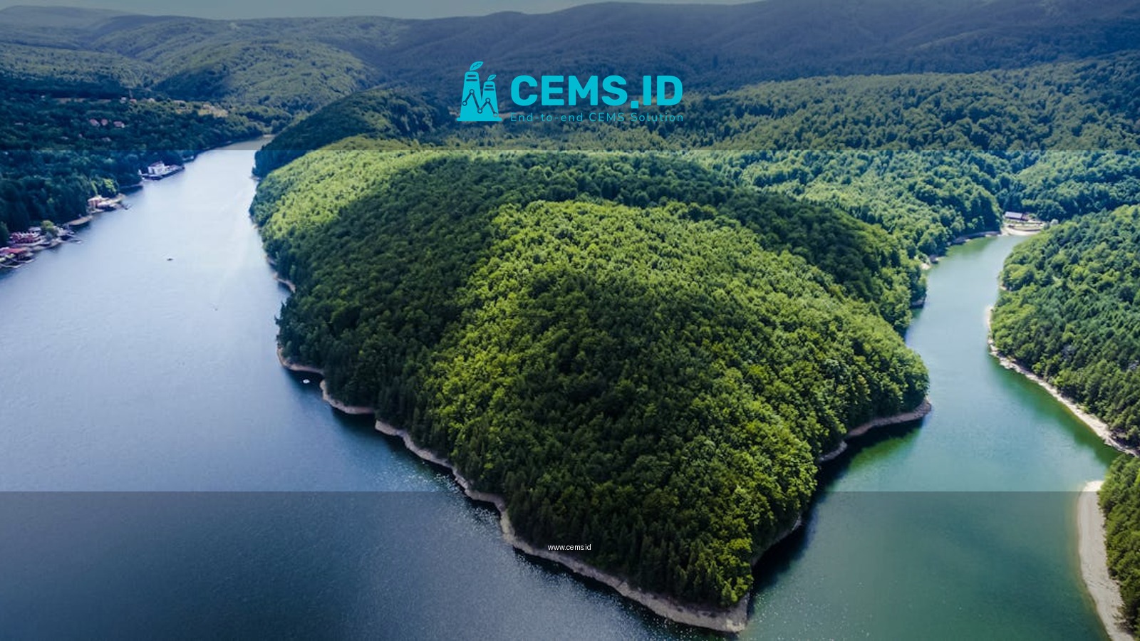 Stunning aerial view of Văliug Lake in Romania, showcasing lush greenery and serene waters.
