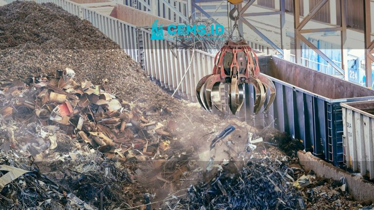 A detailed capture of scrap metal being processed with heavy machinery at a recycling facility.