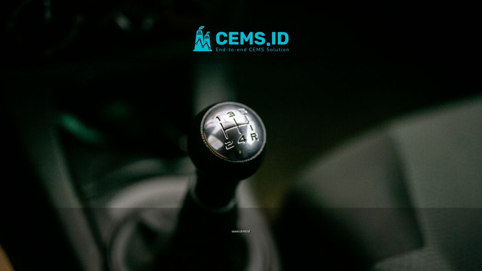Detailed view of a manual gear shifter inside a vehicle, with a focus on the gear shift knob.