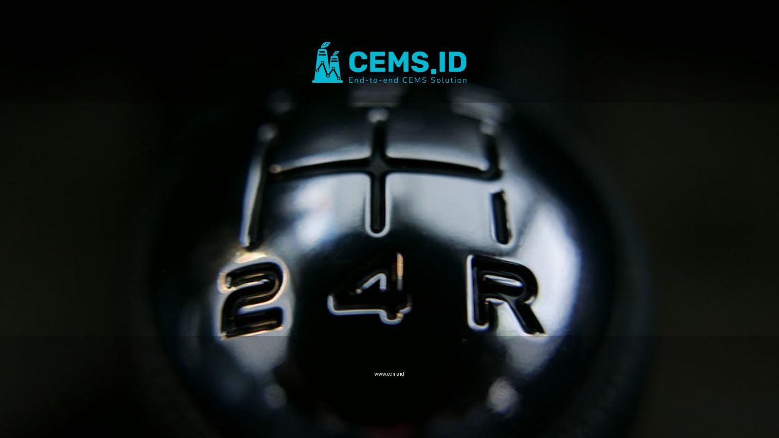 Detailed view of a manual shift knob inside a vehicle, showcasing gear arrangements.
