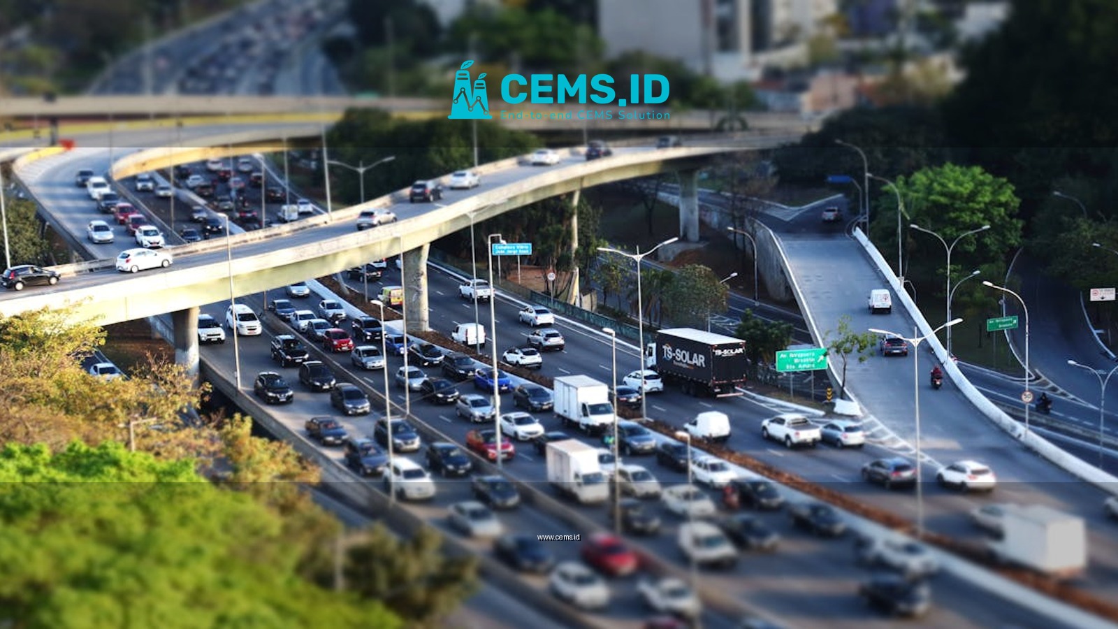 Dense traffic on a multi-level urban highway with tilt-shift effect, showcasing an intricate transportation system.