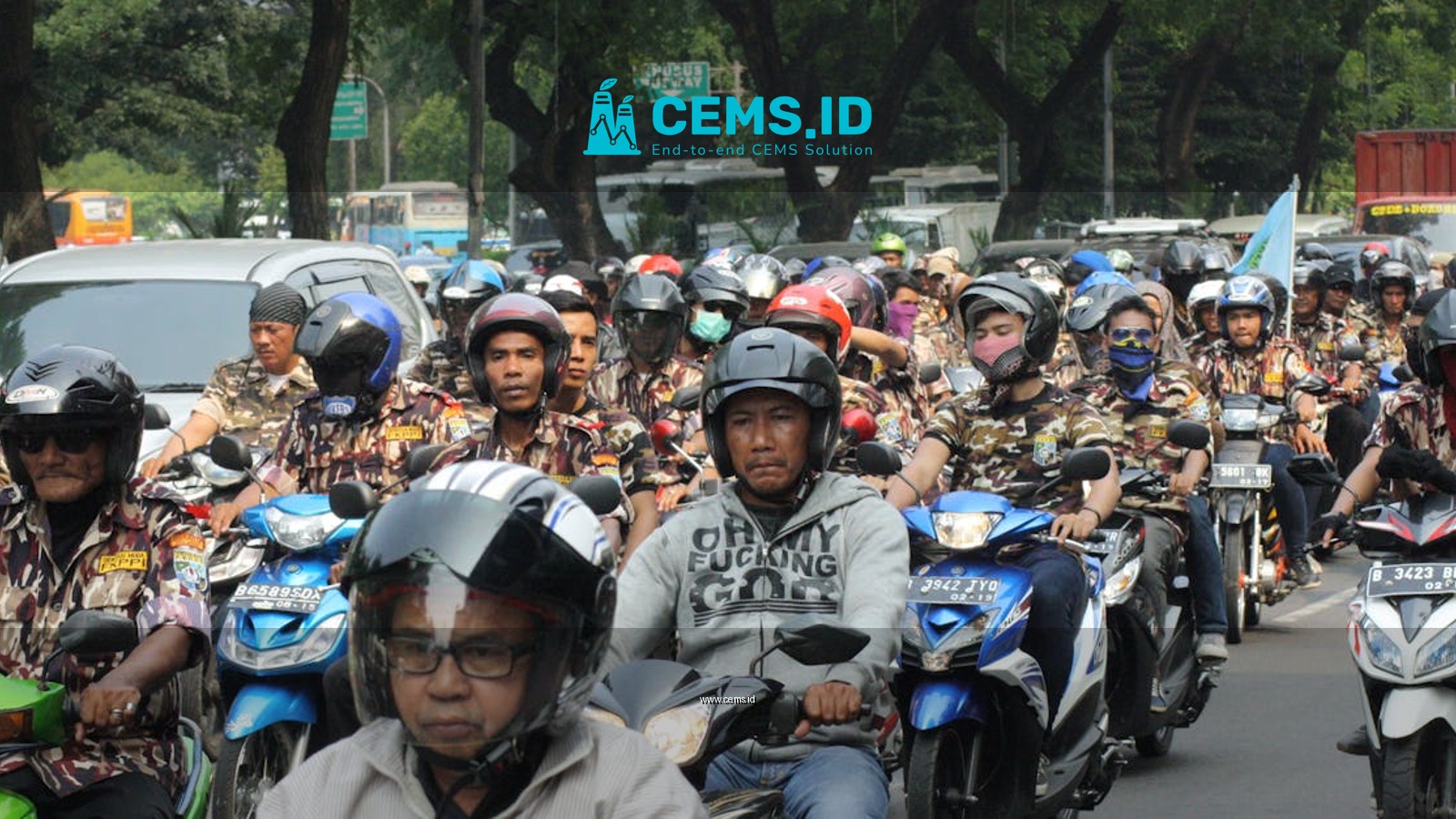 A large group of motorcyclists rallying on a street in Central Jakarta, Indonesia.