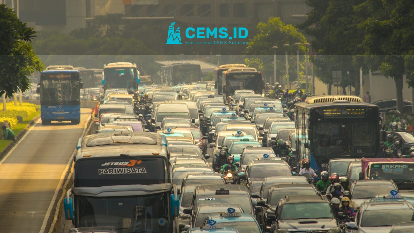 Heavy traffic jam in Jakarta's congested streets during daytime, showcasing urban life challenges.