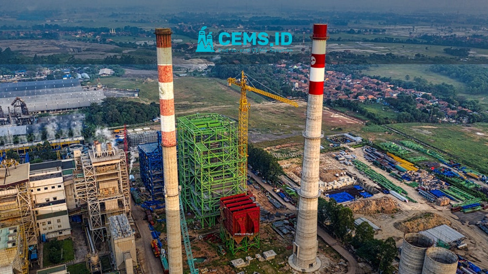 Aerial view of industrial manufacturing plant with chimneys and machinery in Serang, Indonesia.