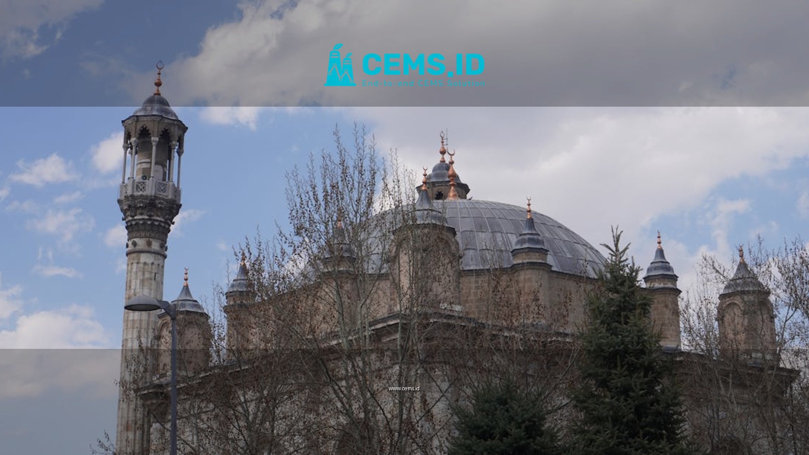 Beautiful architectural details of Aziziye Mosque under a cloudy sky in Konya, Turkey.