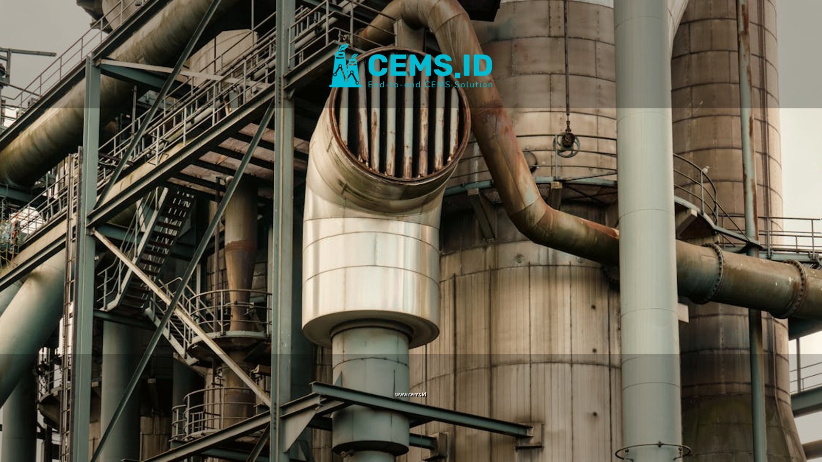 Close-up of industrial factory pipes and metal structures creating a complex machinery scene.