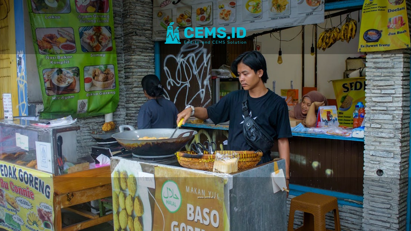 Street food vendor preparing bakso goreng at a food stall in Bogor, West Java, Indonesia.