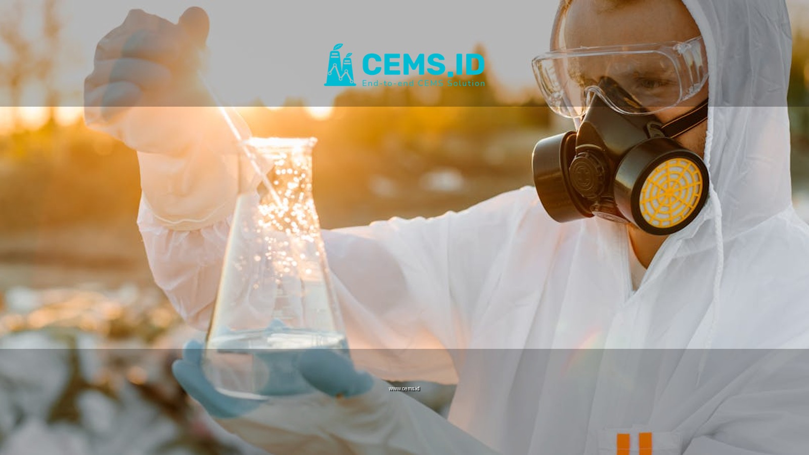 Scientist in protective gear conducting experiment outdoors at sunset.