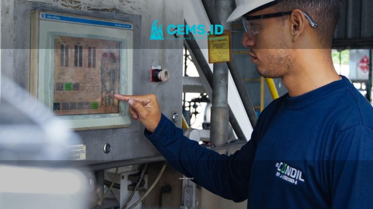 Engineer using control panel at industrial facility, ensuring operational efficiency.