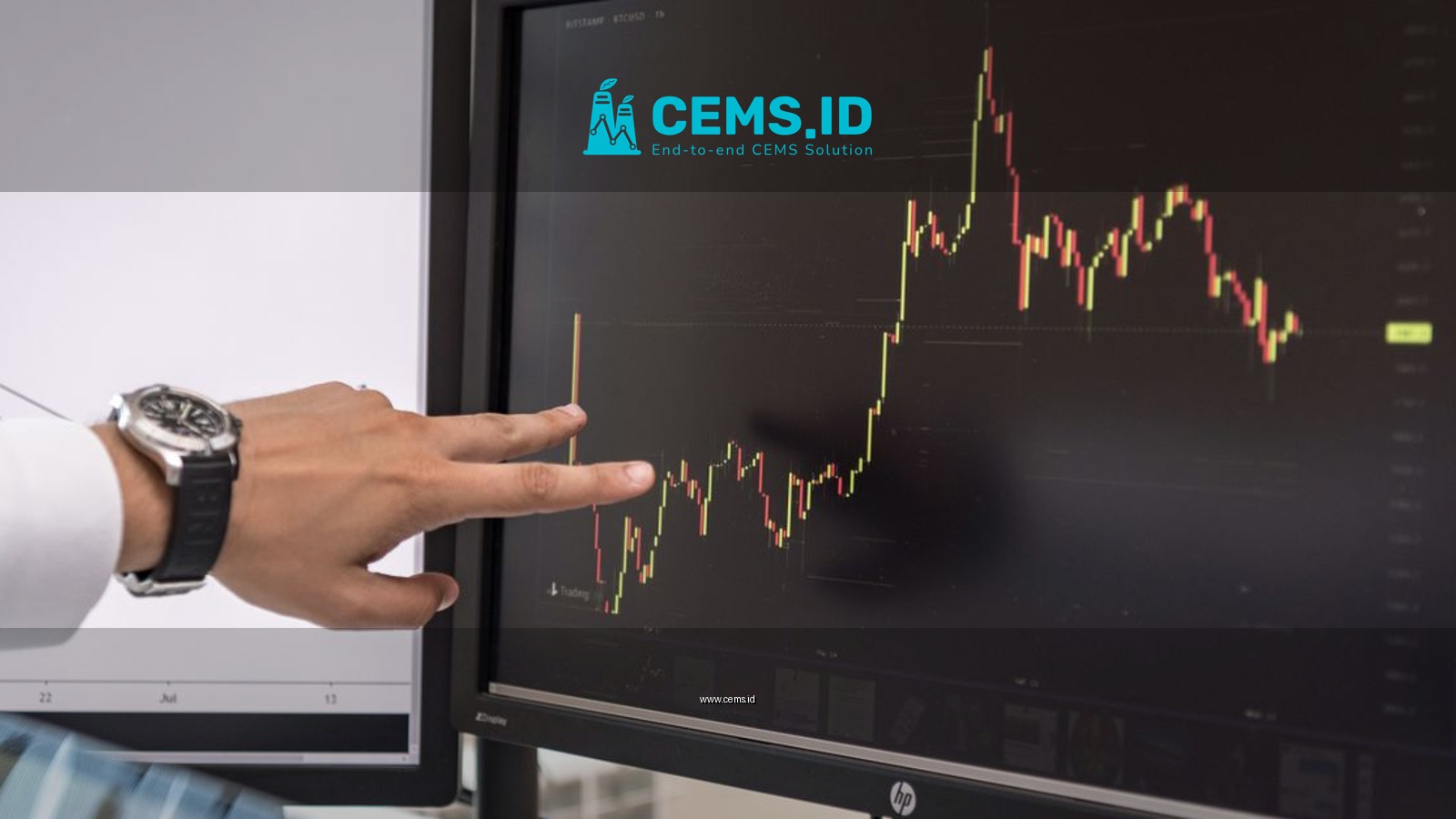Detailed view of a hand pointing at a cryptocurrency trading graph on a monitor.