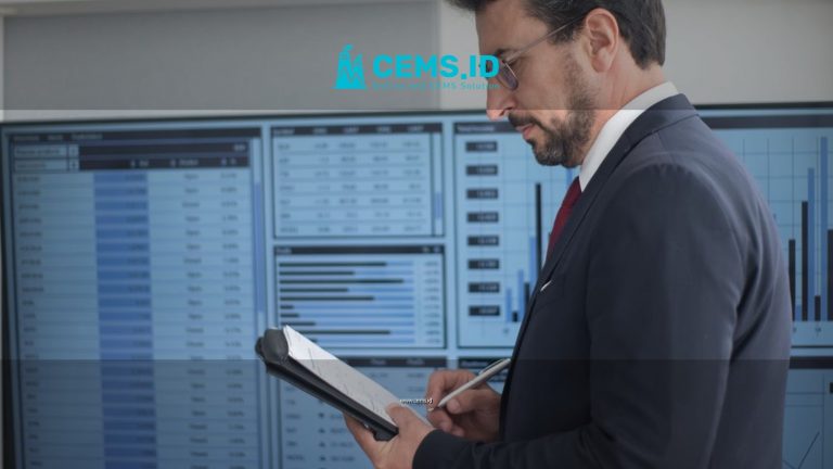 Businessman in a suit analyzing data analytics on large screens, taking notes.
