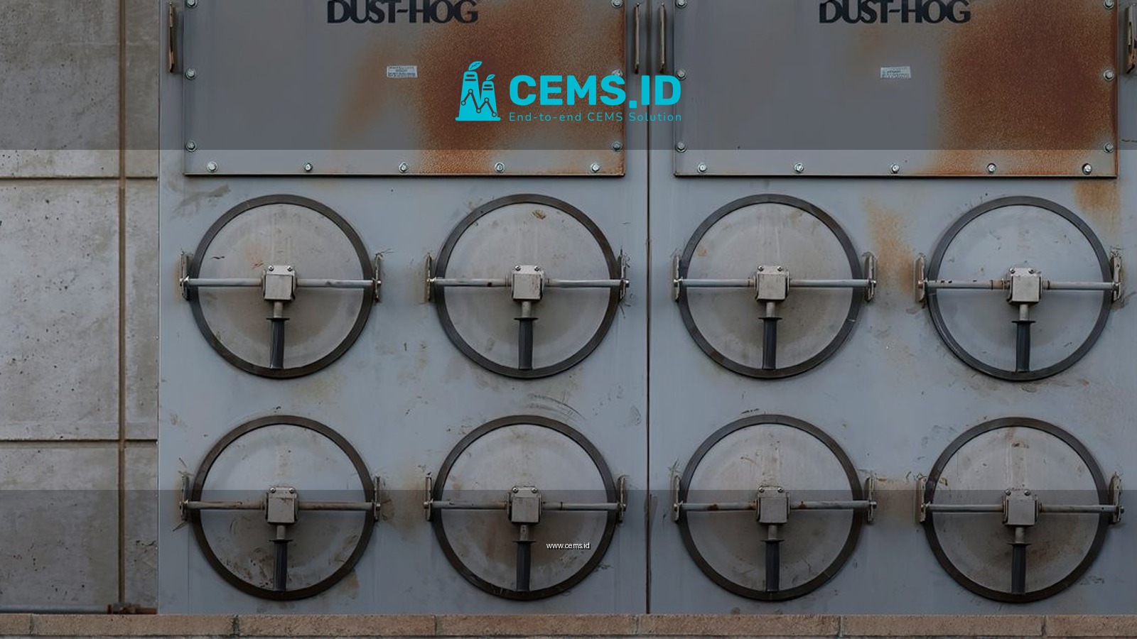Close-up of a Dust-Hog industrial dust collector with six rusty filtration units.