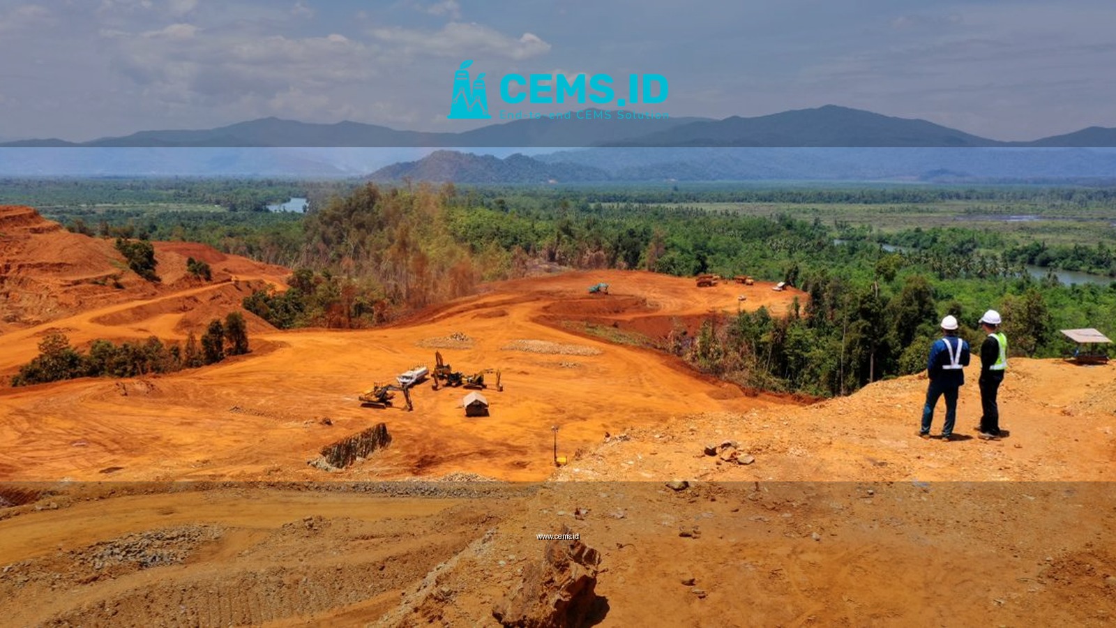 Expansive view of a mining area in Molawe, Sulawesi, with workers and machinery.