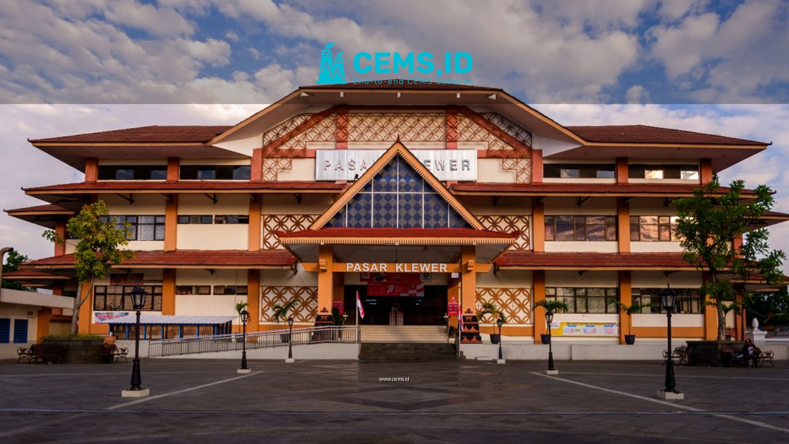 Front view of the iconic Pasar Klewer market building under a cloudy sky.