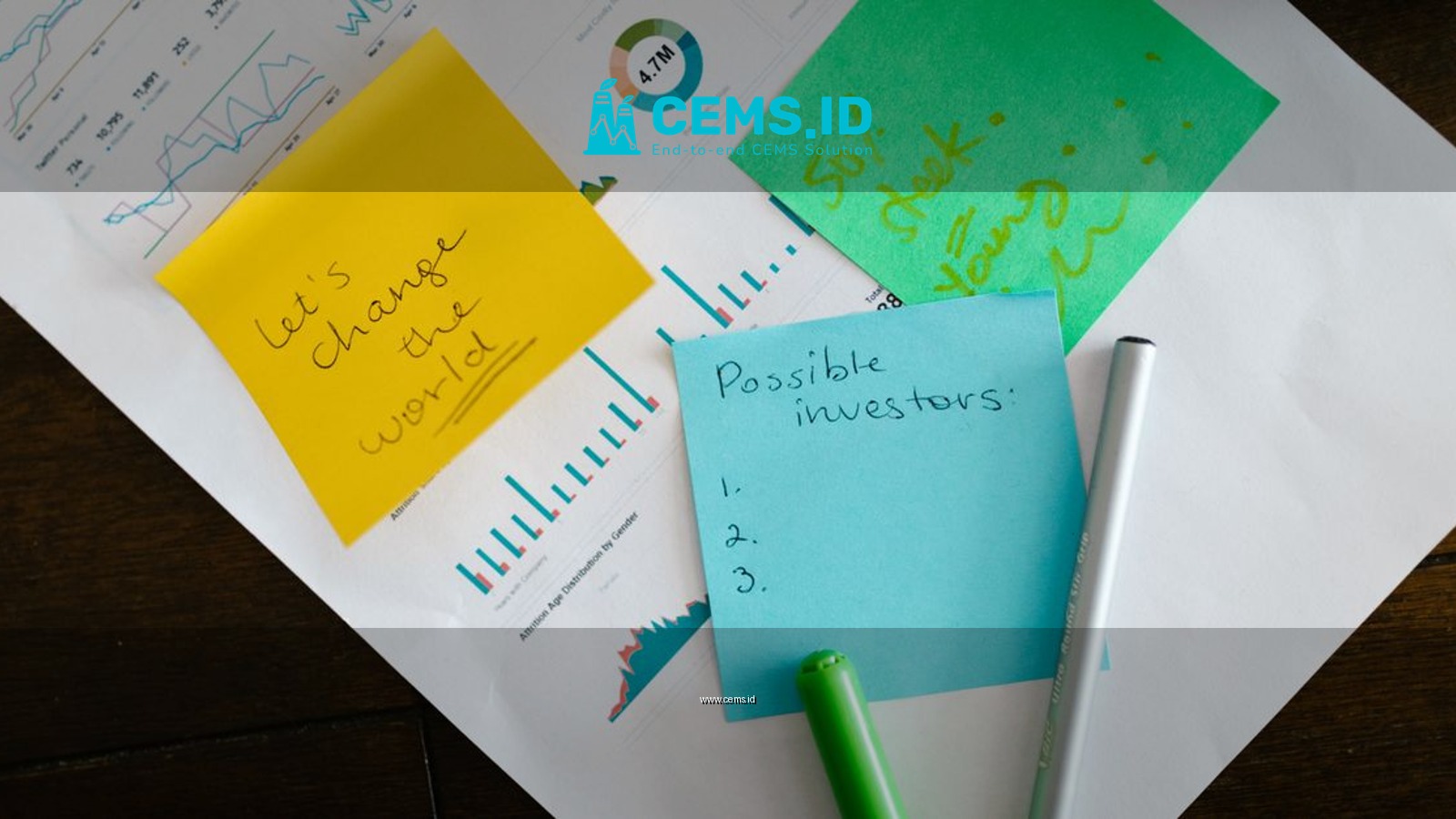 Startup brainstorming with charts, colorful sticky notes, and planning strategies for success.