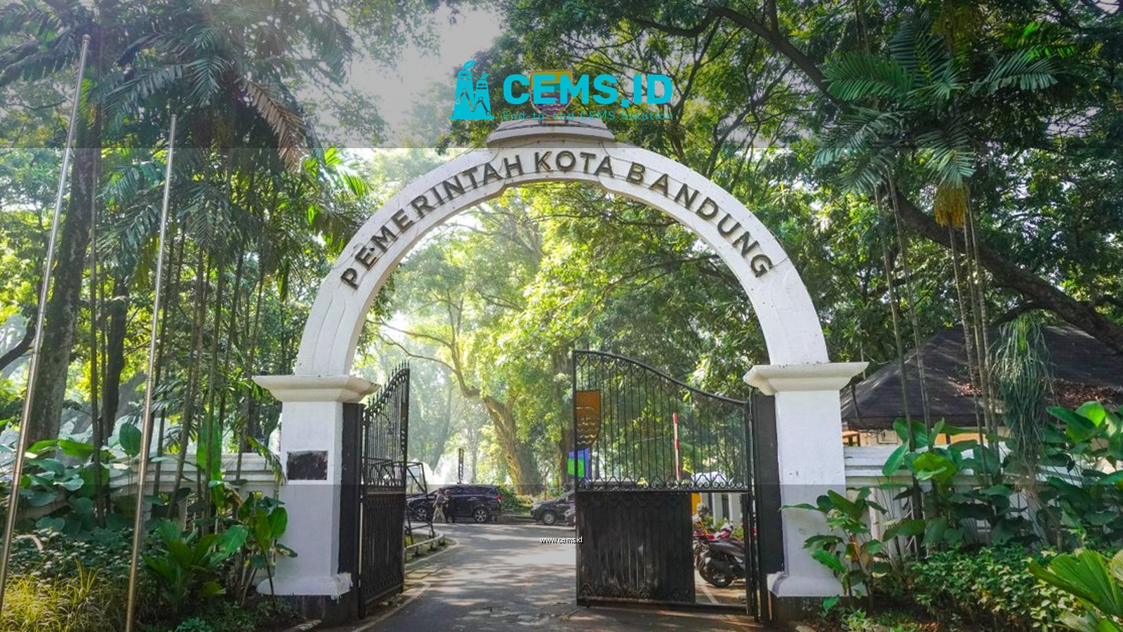 Scenic entrance arch to Bandung City Administration Park surrounded by lush greenery.