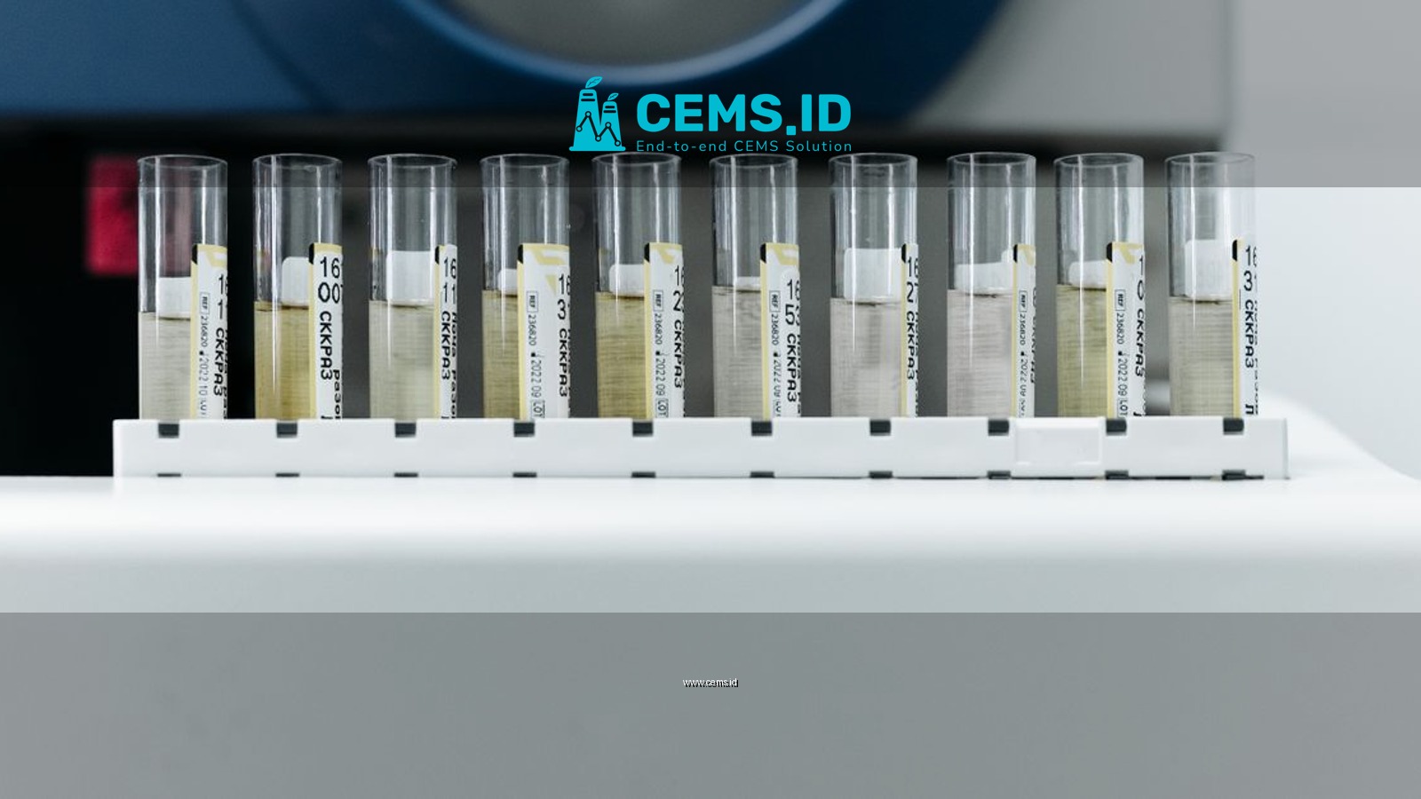 Row of labeled test tubes on a rack in a modern laboratory environment.