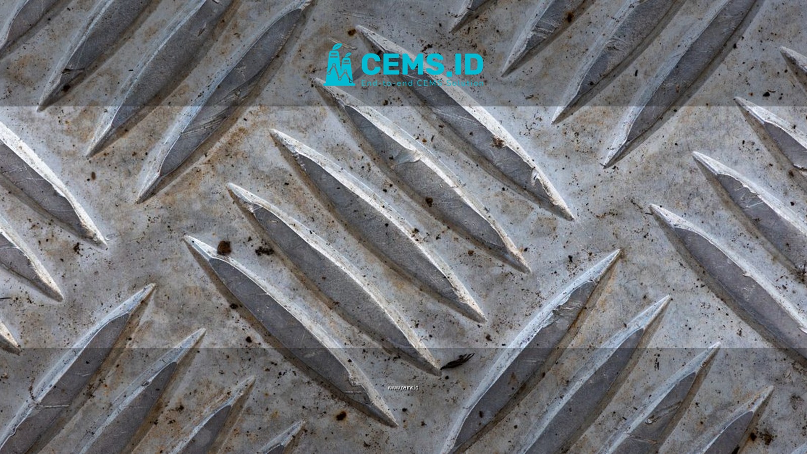 Close-up of a textured metal surface featuring a diamond plate pattern.