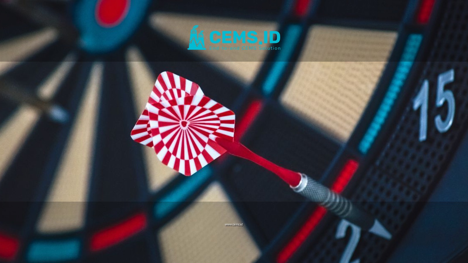 A dart striking the bullseye on a dartboard, showcasing precision and accuracy.
