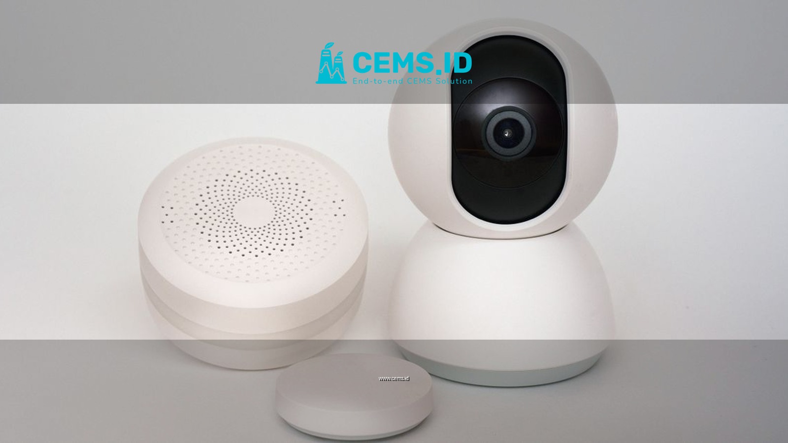 Modern minimalist smart home devices including security camera and sensors in white.