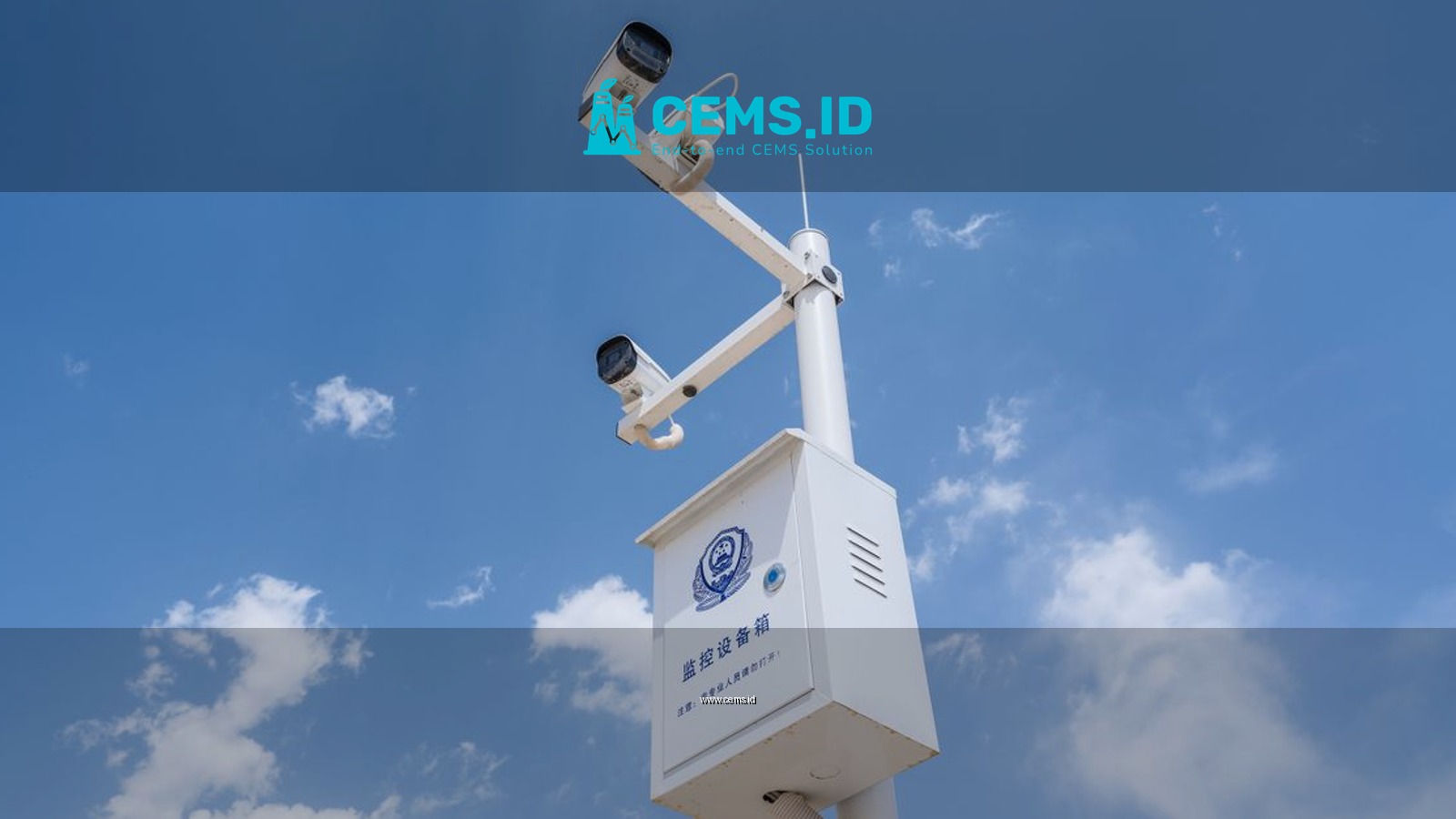 White security cameras mounted on a pole against a bright blue sky with fluffy clouds.