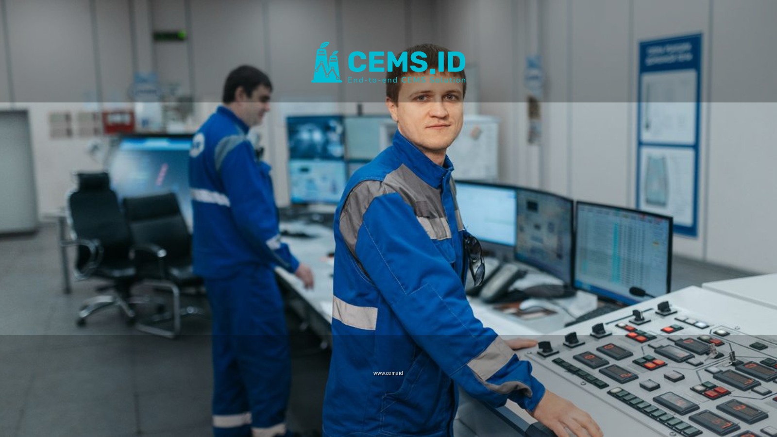Two technicians operating machinery in a modern control room. Industrial setting with advanced equipment.