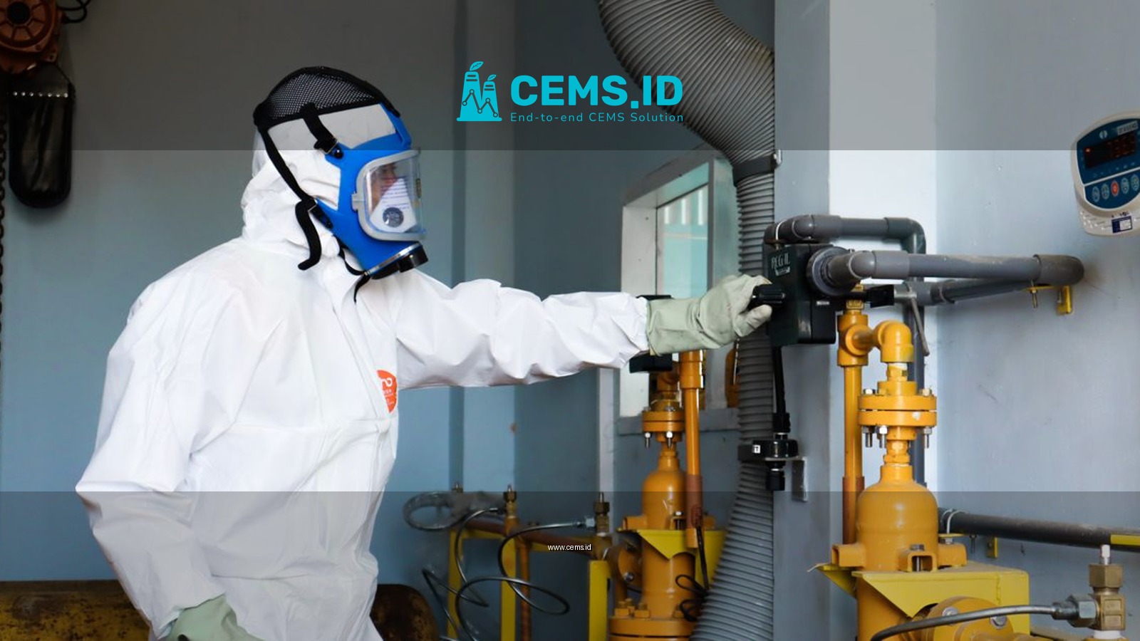 Industrial worker in protective gear inspecting machinery for safety compliance in Indonesia.