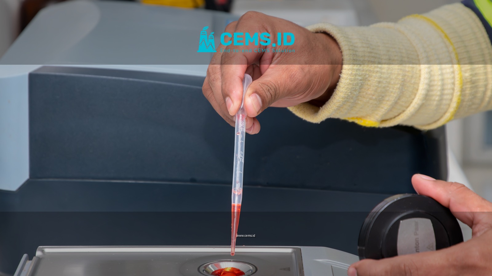 Close-up of a laboratory technician using a pipette for precise measurement in a modern lab.