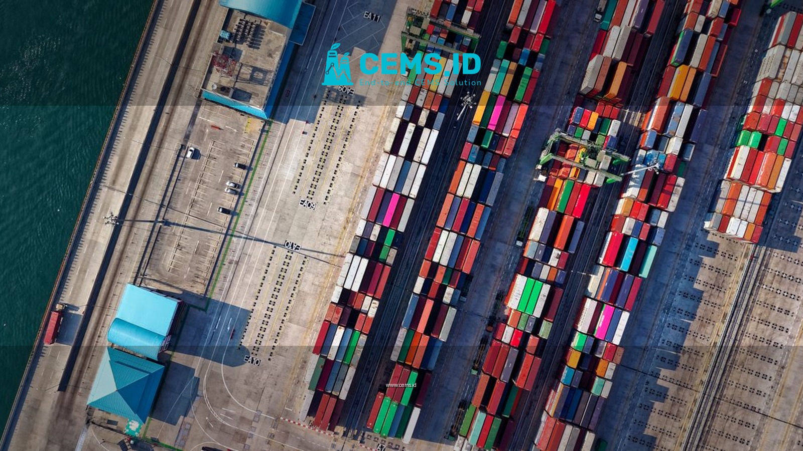 Top view of colorful shipping containers at a bustling port in Jakarta, Indonesia.