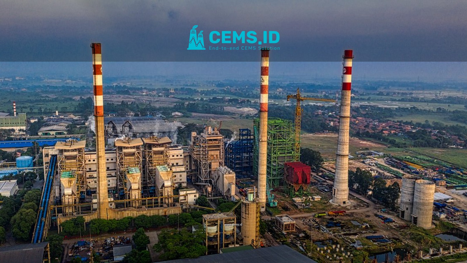 Aerial view of an industrial plant with smokestacks in Serang, Banten, Indonesia during daylight.