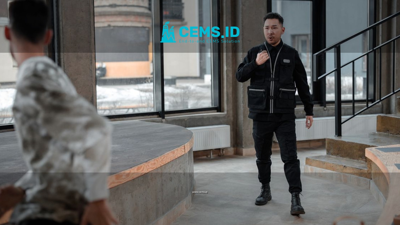 A security guard confronts a fleeing thief in a contemporary indoor setting.