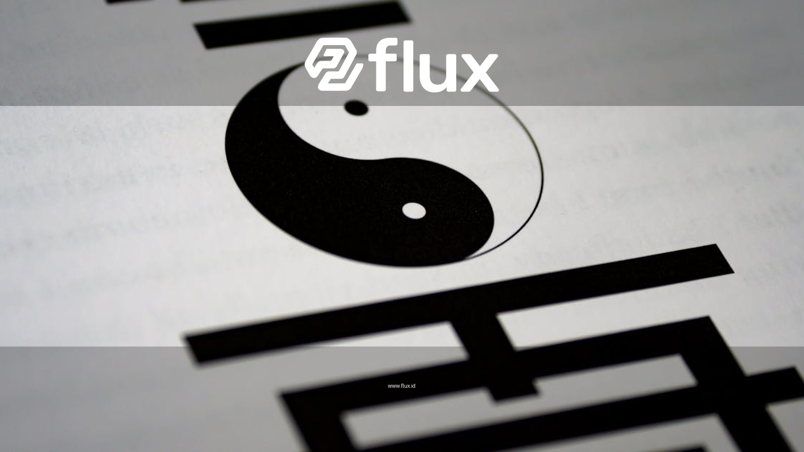 Artistic close-up of yin-yang symbol with Chinese calligraphy on paper.
