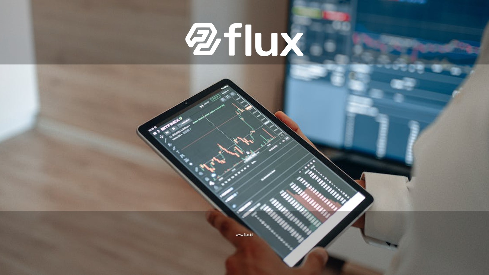 A person uses a tablet to monitor stock market trends and real-time trading graphs.