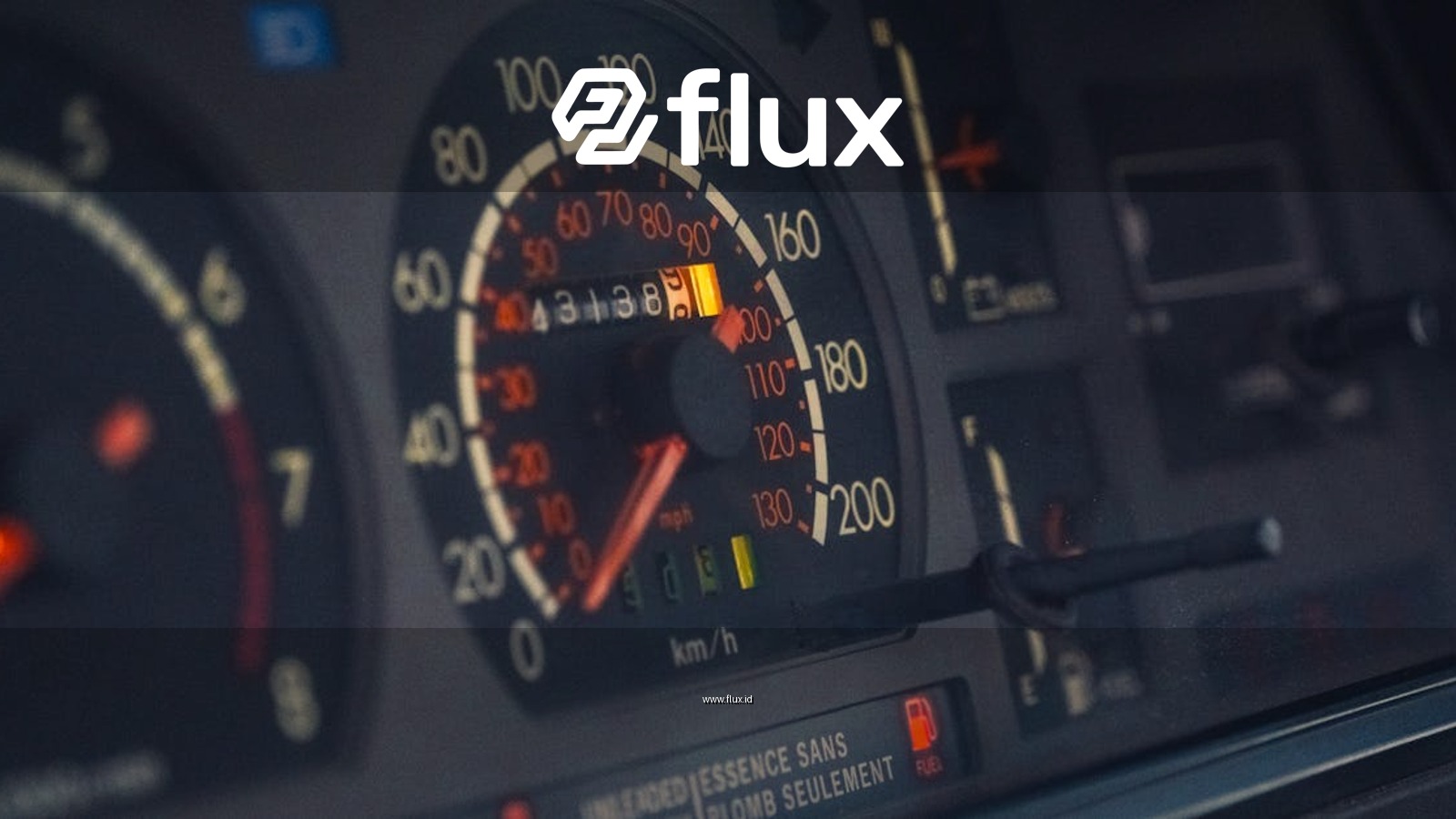 Close-up of a classic car dashboard highlighting the speedometer, odometer, and instrument panel.