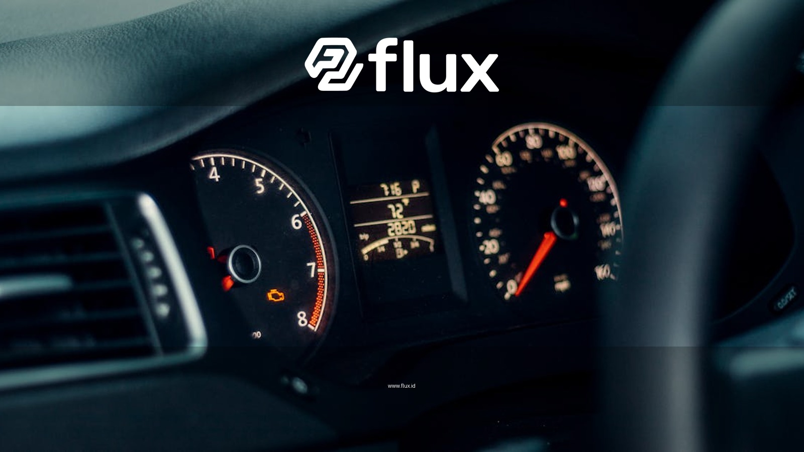 Detailed view of a car's dashboard featuring illuminated gauges and speedometer.