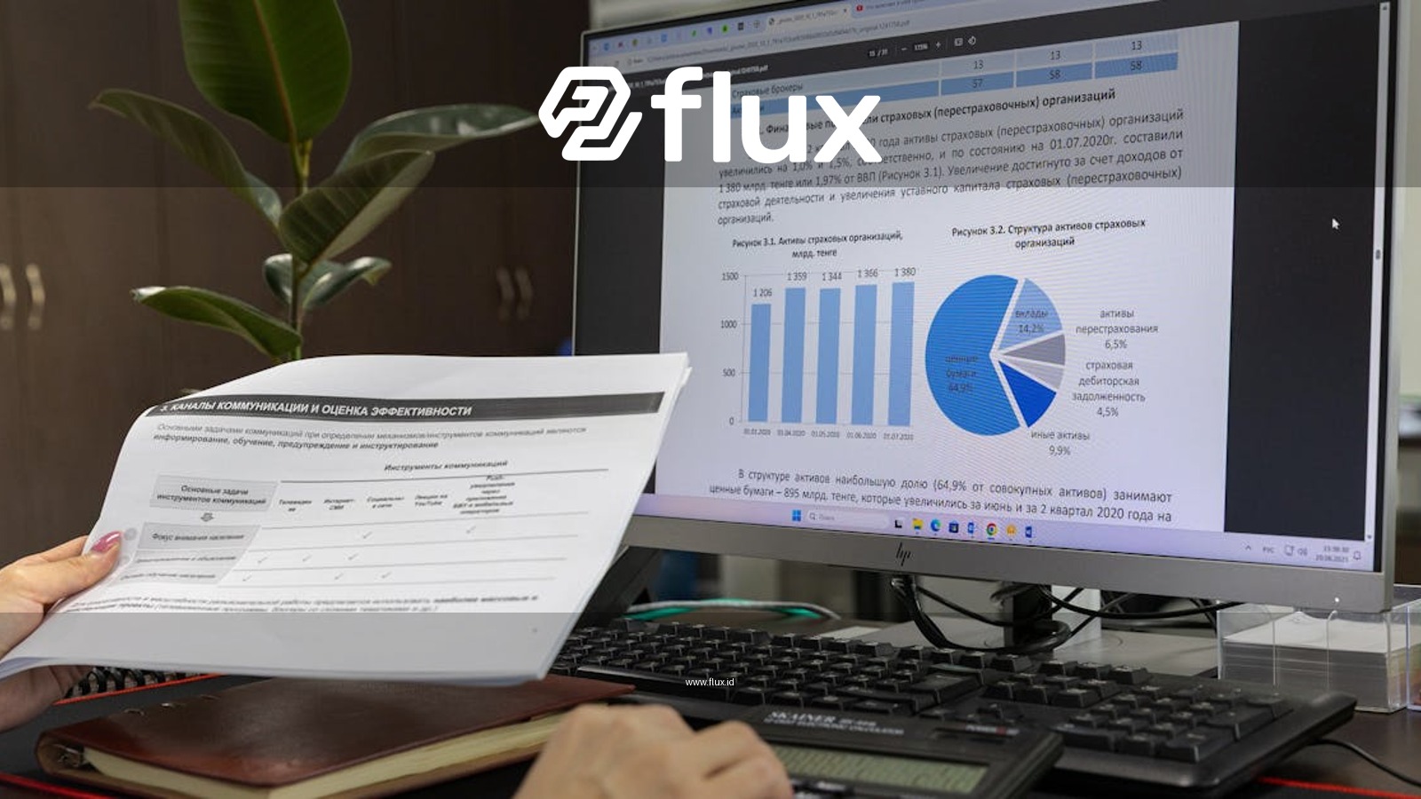 Person analyzing financial data on a computer screen in an office setting.