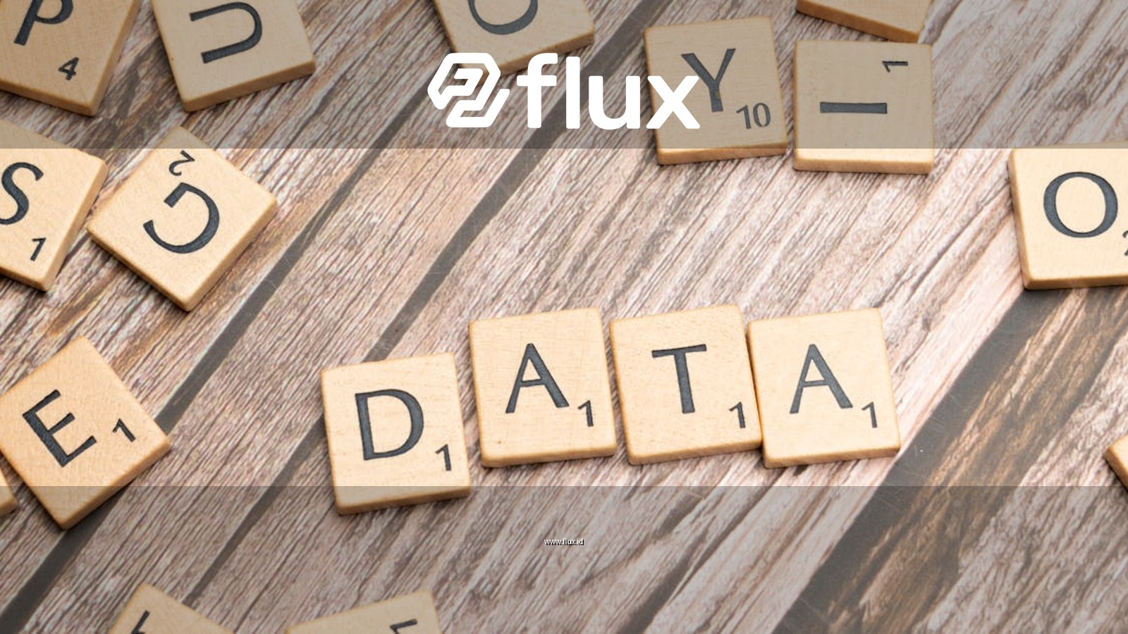 Wooden letter tiles spelling 'DATA' on a wood textured surface, symbolizing data concepts.