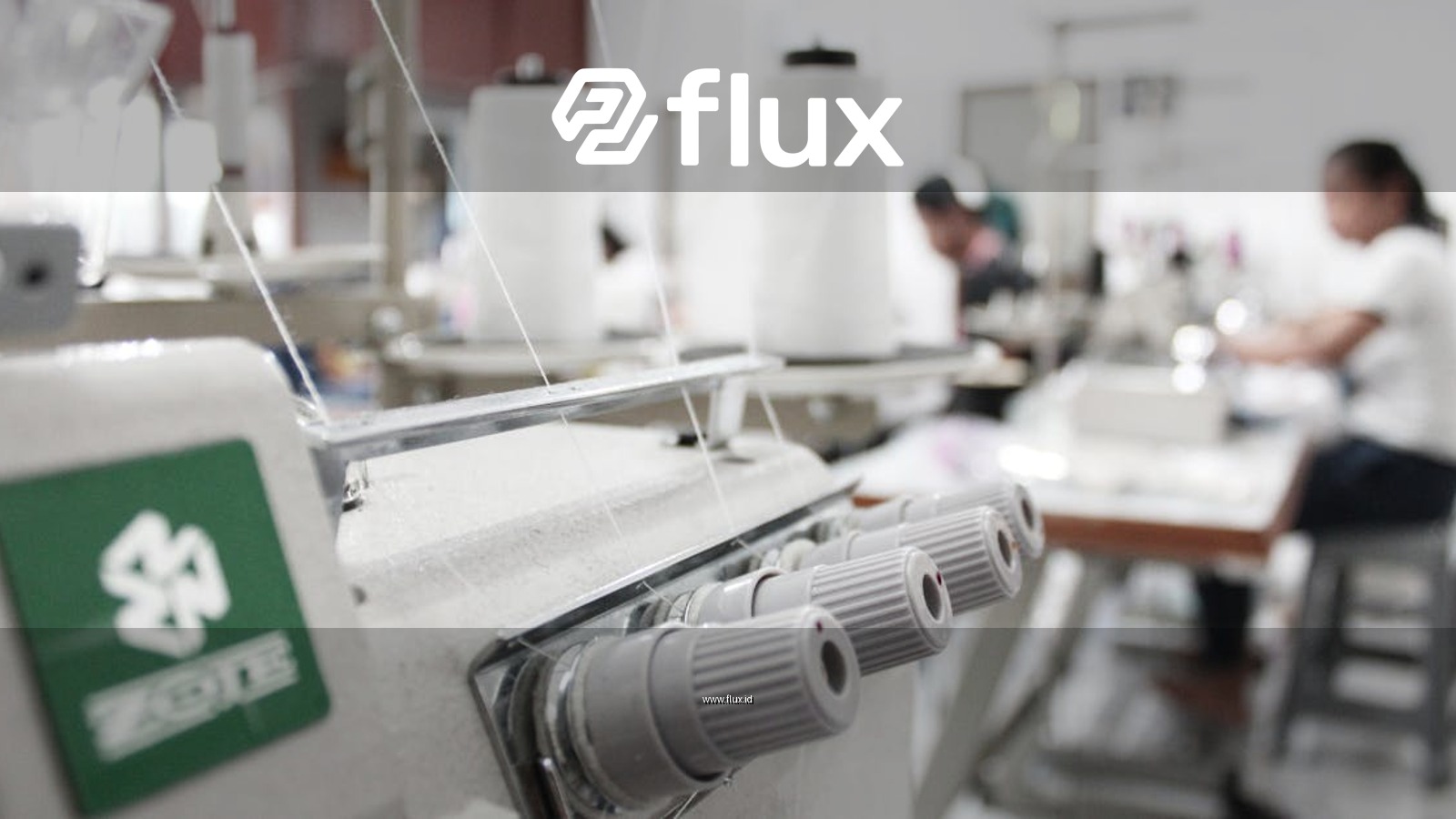 Detailed view of sewing machines in an Indonesian textile workshop, focusing on threads and machinery.