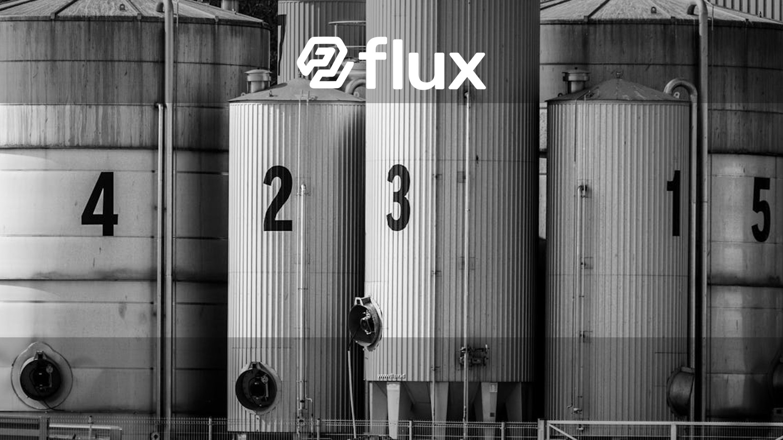 Black and white photo of industrial silos labeled with large numbers 1 to 5.