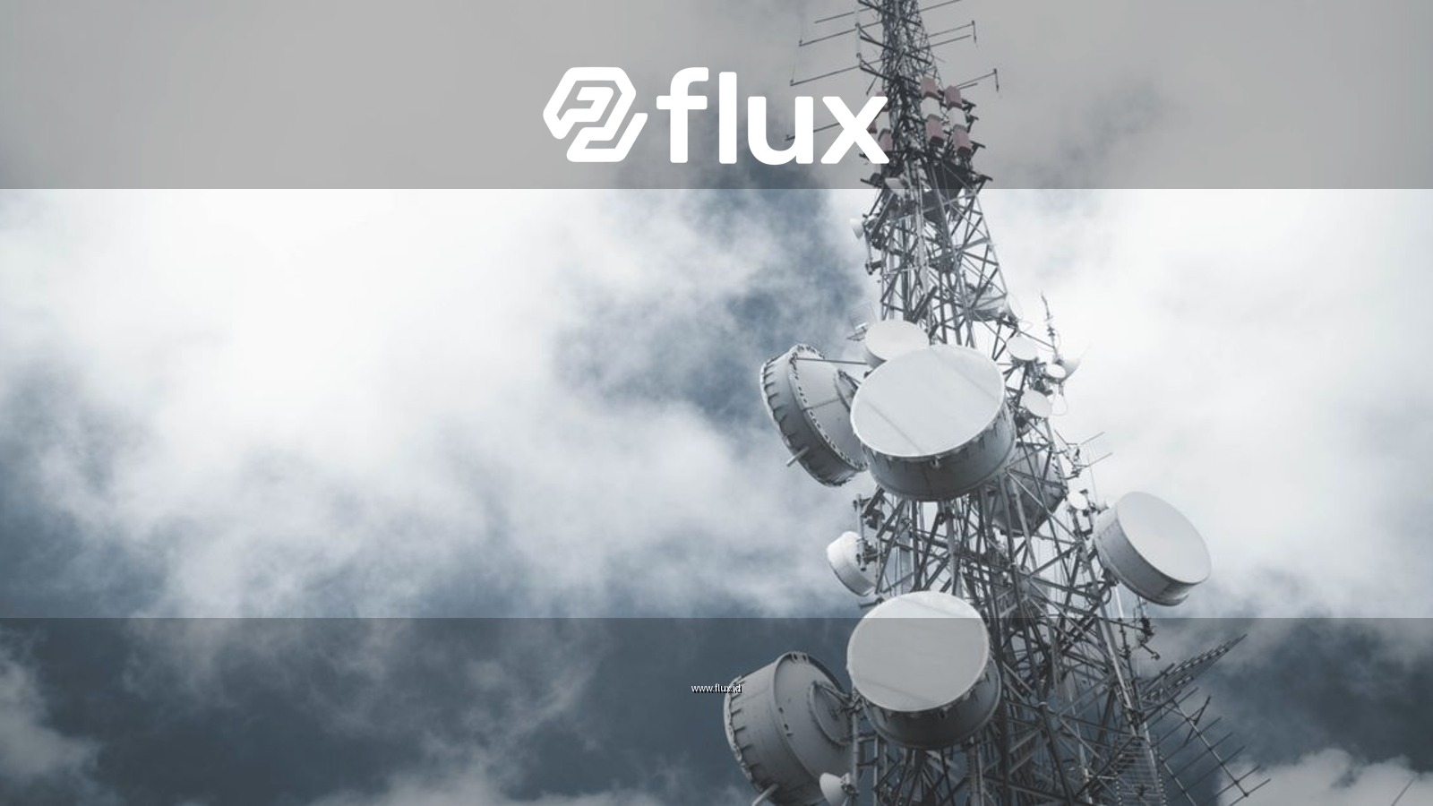 A towering communication mast with satellite dishes, set against a cloudy sky.