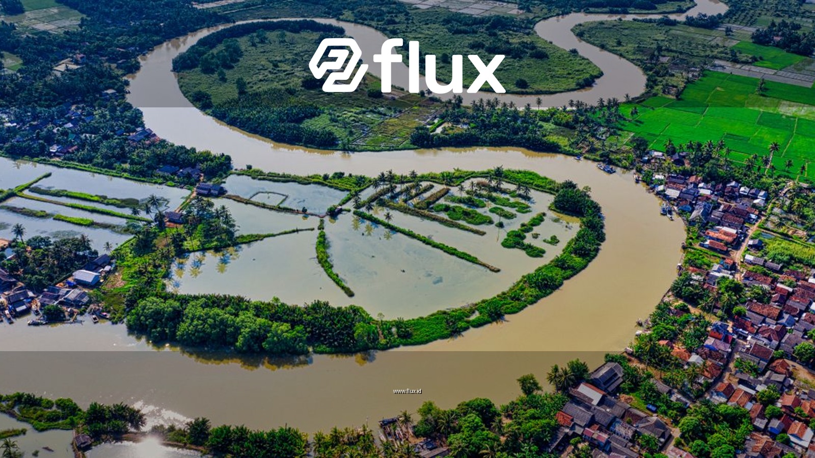 Aerial view capturing the vibrant landscape of a meandering river surrounded by green fields and houses.