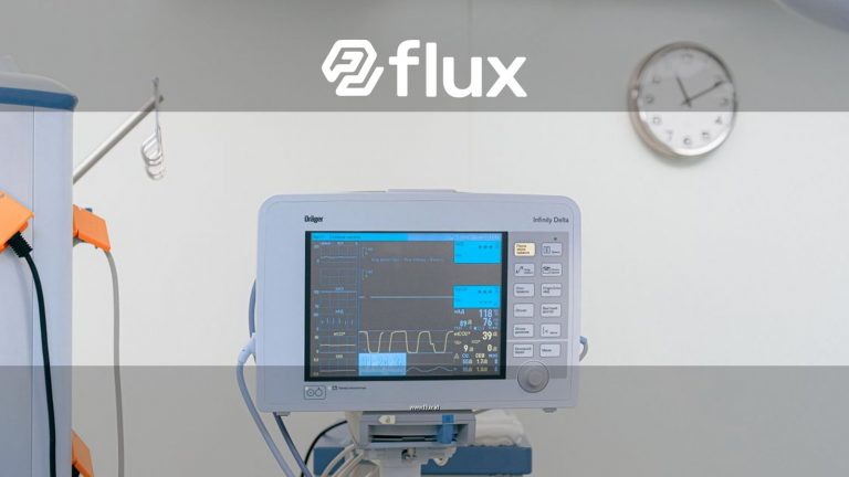 A modern heart rate monitor in a sterile hospital setting, showcasing medical technology.