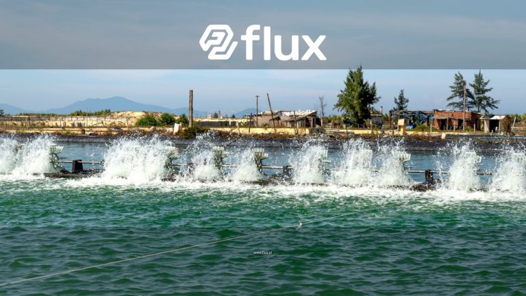 A high-powered water aerator in action at an aquaculture facility, creating a vibrant splash.