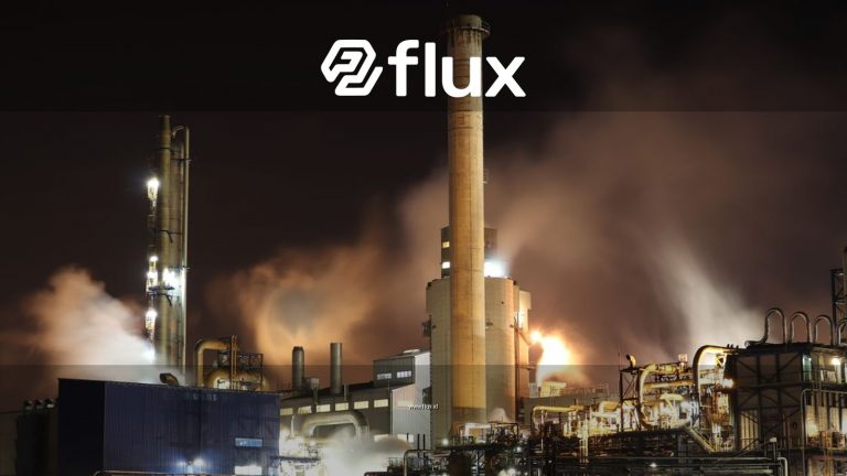 A nighttime view of an industrial factory with smokestacks emitting smoke, highlighting energy production and pollution.