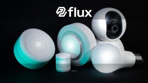 Collection of smart home devices including a camera, bulbs, and sensors on a dark background.