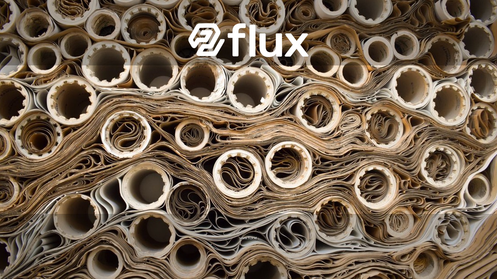 Close-up view of rolled papers creating a complex industrial pattern.