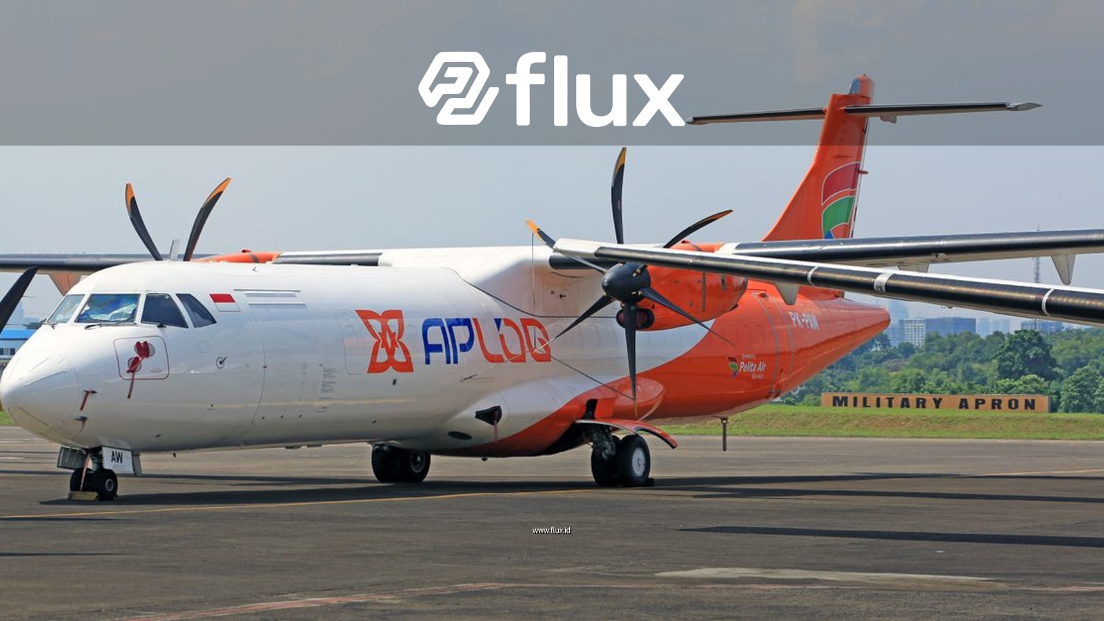 Front view of a commercial propeller aircraft at an Indonesian airport.