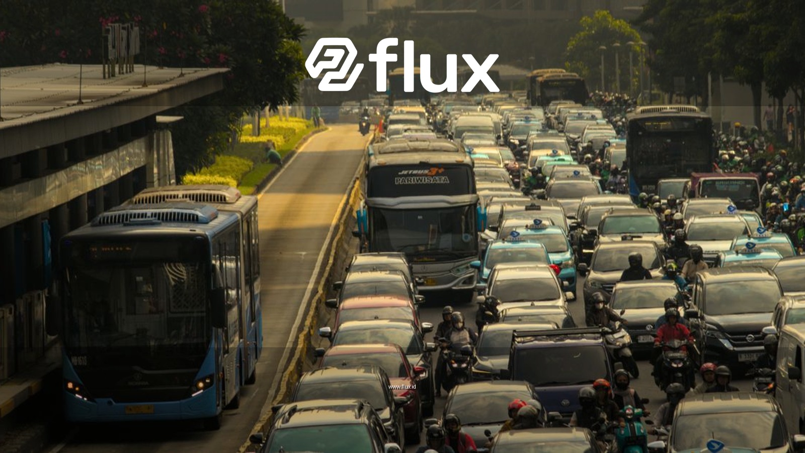 Heavy traffic in a city with cars, buses, and motorcycles on a crowded road.