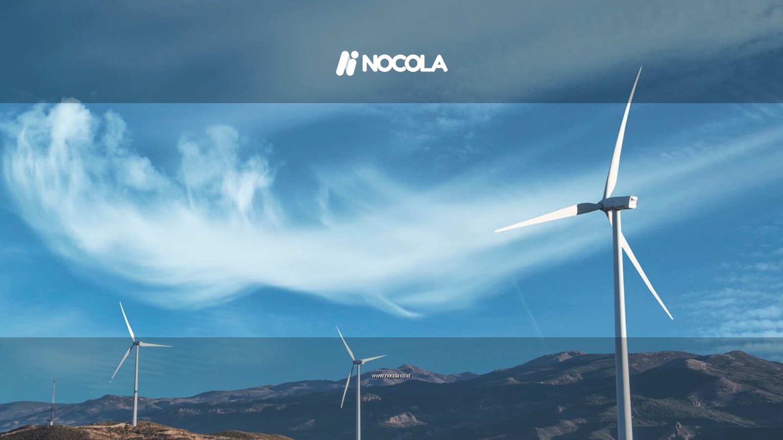 Wind turbines on a hillside capturing clean energy under a serene blue sky.